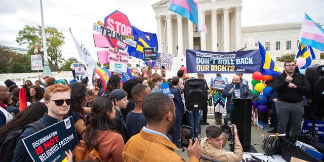 LGBT supporters gather in front of the U.S. Supreme Court, Tuesday, Oct. 8, 2019, in Washington. The Supreme Court is set to hear arguments in its first cases on LGBT rights since the retirement of Justice Anthony Kennedy. Kennedy was a voice for gay rights while his successor, Brett Kavanaugh, is regarded as more conservative. (AP Photo/Manuel Balce Ceneta)