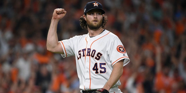 Houston Astros starting pitcher Gerrit Cole (45) reacts after an out against the Tampa Bay Rays during the seventh inning of Game 5 of a baseball American League Division Series in Houston, Thursday, Oct. 10, 2019. (Associated Press)