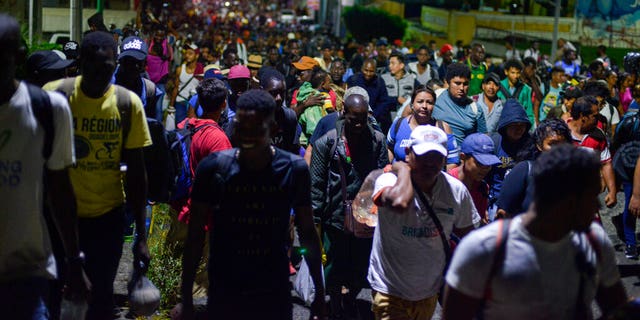 Migrants depart early in the morning from Tapachula, Chiapas state, Mexico, Saturday, Oct. 12, 2019. 