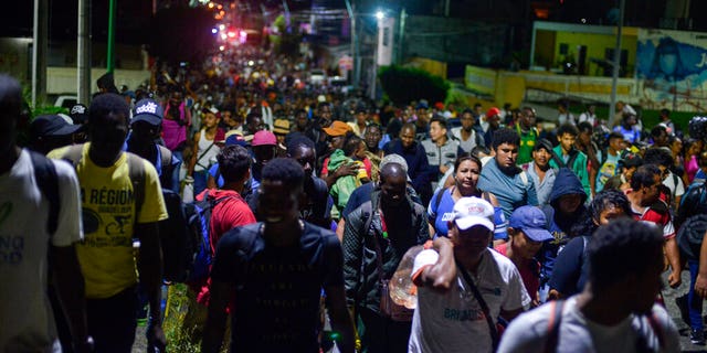 Migrants depart early in the morning from Tapachula, Chiapas state, Mexico, Saturday, Oct. 12, 2019.