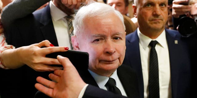 The ruling party leader Jaroslaw Kaczynski leaves a polling station after his vote in Warsaw, Poland, Sunday, Oct. 13, 2019. 