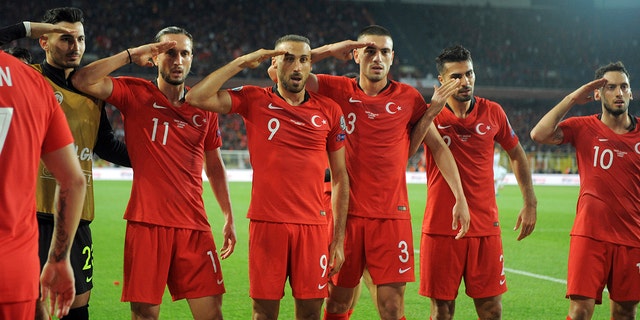 Turkish soccer players gesture as they celebrate their 1-0 win against Albania during a Euro 2020 Group H qualifying soccer match in Istanbul's Ulker Stadium, Friday, Oct. 11, 2019. (AP Photo)