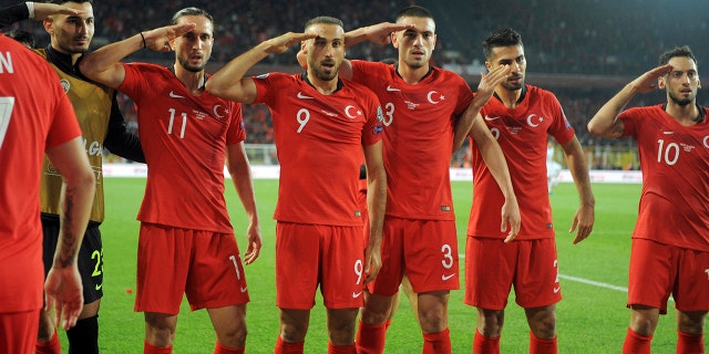 Turkish soccer players gesture as they celebrate their 1-0 win against Albania during a Euro 2020 Group H qualifying soccer match in Istanbul's Ulker Stadium, Friday, Oct. 11, 2019. (AP Photo)