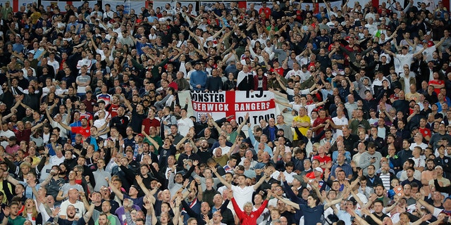 England fans celebrate during the Euro 2020 group A qualifying soccer match between Bulgaria and England, at the Vasil Levski national stadium, in Sofia, Bulgaria, Monday, Oct. 14, 2019. 