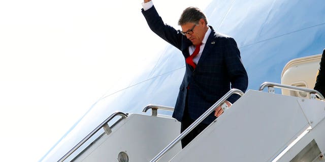 Energy Secretary Rick Perry gesturing as he arrived on Air Force One with President Trump at Naval Air Station Joint Reserve Base in Fort Worth, Texas, on Thursday. (AP Photo/Andrew Harnik)