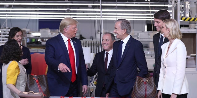 President Donald Trump tours the Louis Vuitton Workshop Rochambeau in Alvarado, Texas, Thursday, Oct. 17, 2019, with Bernard Arnault, chief executive of LVMH, third from right, Alexandre Arnault, second from right and Ivanka Trump. (AP Photo/Andrew Harnik)