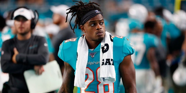 In this Aug. 8, 2019, file photo, Miami Dolphins safety Bobby McCain watches during the second half of a preseason NFL football game against the Atlanta Falcons in Miami Gardens, Fla. McCain will be disciplined by the team for his verbal confrontation with a 13-year-old boy who was rooting for the Buffalo Bills. (AP Photo/Wilfredo Lee, File)