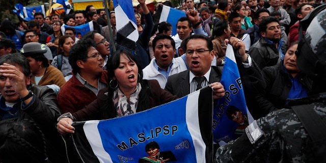 Supporters of Bolivian President Evo Morales, who is running for a fourth term, rally outside the Supreme Electoral Court where election ballots are being counted in La Paz, Bolivia, Monday, Oct. 21, 2019.
