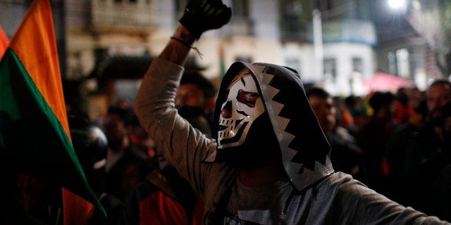 Supporters of opposition presidential candidate Carlos Mesa, a former president, gather outside the Supreme Electoral Court where election ballots are being counted in La Paz.