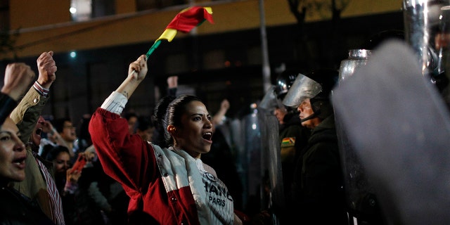 Supporters of opposition presidential candidate Carlos Mesa protest outside the Supreme Electoral Court where election ballots are being counted in La Paz, Bolivia, Monday, Oct. 21, 2019.