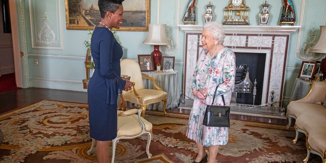 Queen Elizabeth II receives the High Commissioner for Grenada, Lakisha Grant, during a private audience at Buckingham Palace, London.