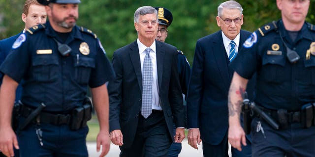 U.S. Capitol Police escorting acting Ambassador William Taylor at the Capitol on Tuesday. (AP Photo/J. Scott Applewhite)