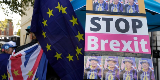 An anti-Brexit demonstrators banner near Parliament in London, Tuesday, Oct. 22, 2019. 