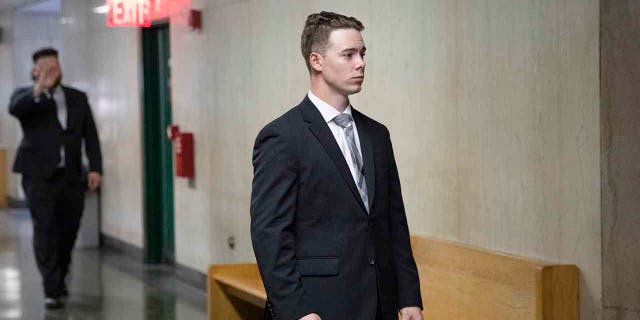 In this July 31, 2019, file photo, Maxwell Hare, center, and John Kinsman, back left, arrive at court during their trial in New York. The members of the far-right Proud Boys have each been sentenced to four years in prison for their part in a street fight that followed a speech last year at New York's Metropolitan Republican Club. (AP Photo/Mark Lennihan, File)