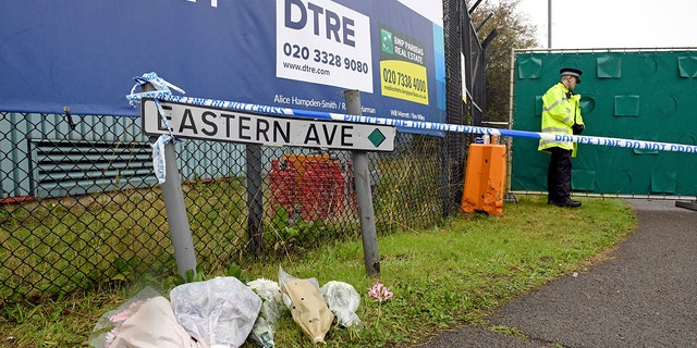 Floral tributes at the Waterglade Industrial Park in Thurrock, Essex, England Thursday the day after 39 bodies were found inside a truck on the industrial estate. British media are reporting that the 39 people found dead in the back of a truck in southeastern England were Chinese citizens.