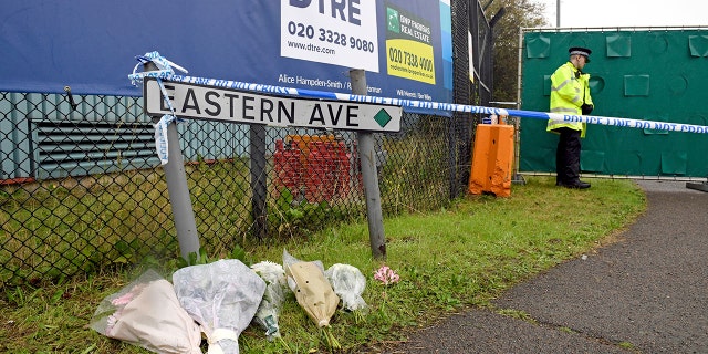 Floral tributes at the Waterglade Industrial Park in Thurrock, Essex, England Thursday the day after 39 bodies were found inside a truck on the industrial estate. British media are reporting that the 39 people found dead in the back of a truck in southeastern England were Chinese citizens.