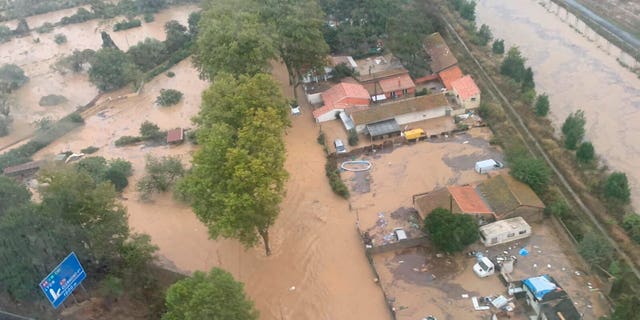 This Oct. 23, 2019 image made by Twitter user @SDIS34 shows a flooded area in the southern France. France's Interior ministry says three people have been killed in torrential rains that flooded towns and villages in southern France this week.