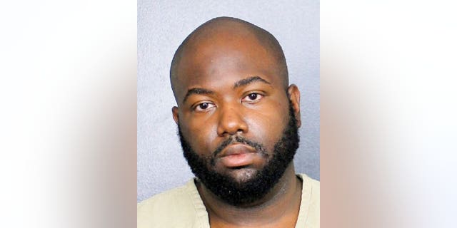 This Tuesday, Oct. 22, 2019 booking photo released by the Broward County Sheriff's Office shows Christopher Johnson. 