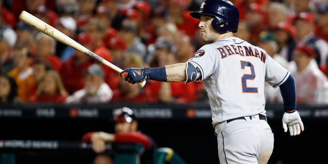Houston Astros' Alex Bregman watches his grand slam against the Washington Nationals during the seventh inning of Game 4 of the World Series, Oct. 26, 2019, in Washington. (Associated Press)