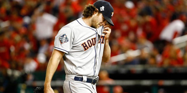 Houston Astros starting pitcher Gerrit Cole walks to the dugout after the third inning of Game 5 of the baseball World Series against the Washington Nationals Sunday, Oct. 27, 2019, in Washington. 