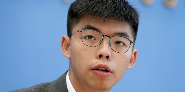 In this Sept. 11, 2019, file photo, Hong Kong activist Joshua Wong addresses the media during a press conference in Berlin, Germany.