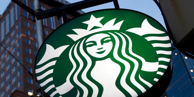FILE - This June 26, 2019 file photo shows a Starbucks sign outside a Starbucks coffee shop in downtown Pittsburgh. Starbucks Corp. reports financial earns on Wednesday, Oct. 30. (AP Photo/Gene J. Puskar, File)
