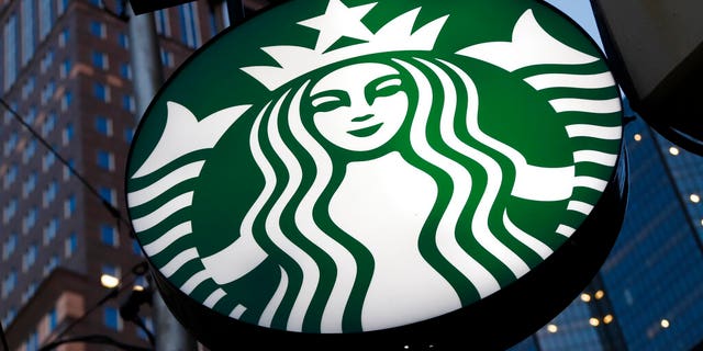 FILE - This June 26, 2019 file photo shows a Starbucks sign outside a Starbucks coffee shop in downtown Pittsburgh. Starbucks Corp. reports financial earns on Wednesday, Oct. 30. (AP Photo/Gene J. Puskar, File)