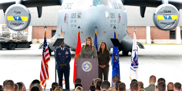 First lady Melania Trump addresses military members and their families on Wednesday, Oct. 30, 2019, at Joint Base Charleston, S.C. Listening are Col. Terrence Adams, left, and Karen Pence, wife of Vice President Mike Pence. (AP Photo/Mic Smith)