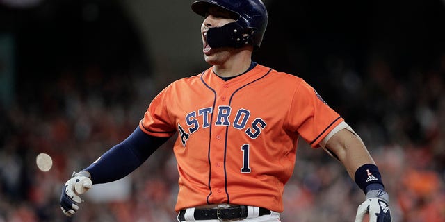 Houston Astros' Carlos Correa reacts to his RBI single during the fifth inning of Game 7 of the baseball World Series against the Washington Nationals Wednesday, Oct. 30, 2019, in Houston. (Associated Press)