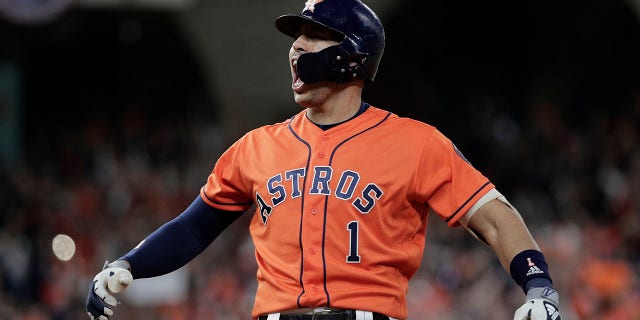 Houston Astros' Carlos Correa reacts to his RBI single during the fifth inning of Game 7 of the baseball World Series against the Washington Nationals Wednesday, Oct. 30, 2019, in Houston. (Associated Press)