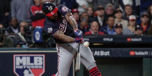Washington Nationals' Howie Kendrick hits a two-run home run during the seventh inning of Game 7 of the baseball World Series against the Houston Astros Wednesday, Oct. 30, 2019, in Houston. (Associated Press)