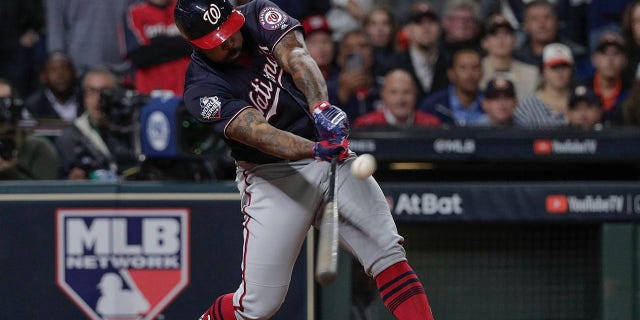 Washington Nationals' Howie Kendrick hits a two-run home run during the seventh inning of Game 7 of the baseball World Series against the Houston Astros Wednesday, Oct. 30, 2019, in Houston. (Associated Press)