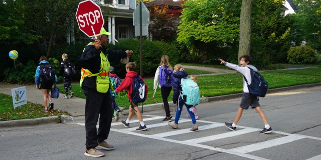 Every morning, Alec Childress, a crossing guard in Wilmette, Ill., tells kids with a big smile, "Peace, I gotcha!"