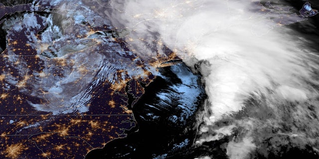 The "bomb cyclone" can be seen off the coast of the Northeast on Thursday.