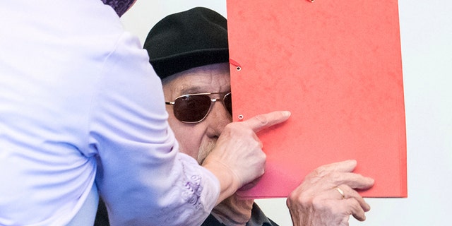 Bruno Dey, a 93-year-old former SS guard in the concentration camp Stutthof, arrives at the regional court in Hamburg, Germany, on Monday.