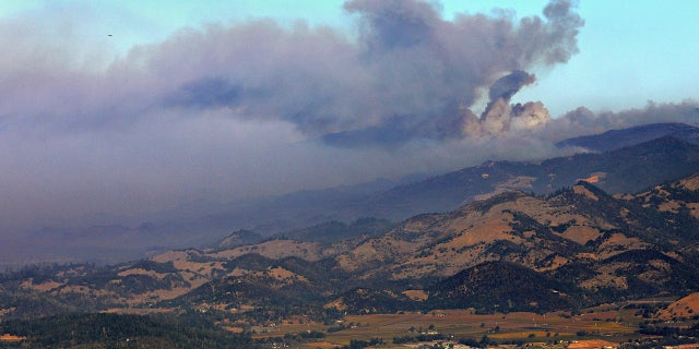 A smoke plume from the Kincade Fire is seen just north of Mt. Saint Helena, Calif., Tuesday, Oct. 29, 2019.