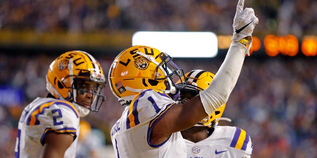 LSU wide receiver Ja'Marr Chase (1) celebrates his touchdown reception in the second half of an NCAA college football game against Florida in Baton Rouge, La., Saturday, Oct. 12, 2019. LSU won 42-28. (AP Photo/Gerald Herbert)