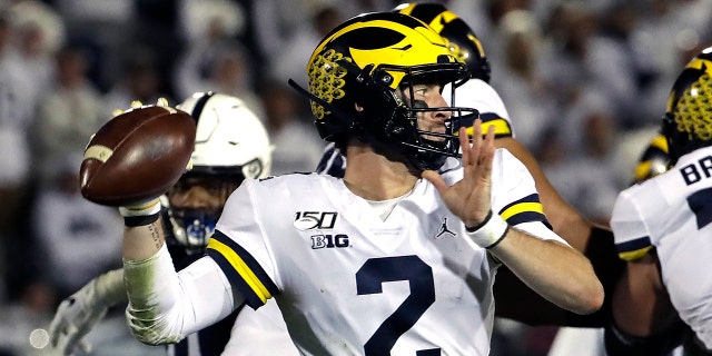 Michigan quarterback Shea Patterson throws a pass during the first half of the team's NCAA college football game against Penn State in State College, Pa., Saturday, Oct. 19, 2019. (AP Photo/Gene J. Puskar)
