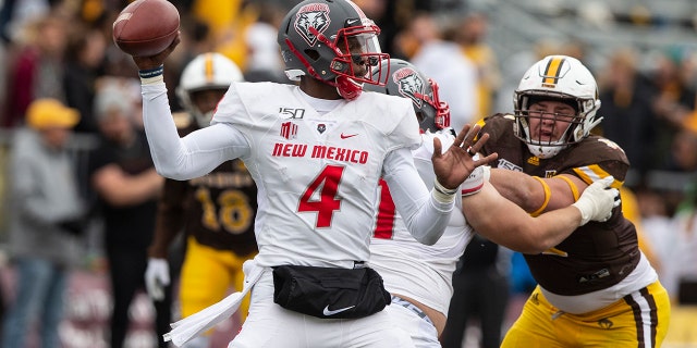 New Mexico quarterback Sheriron Jones throws a pass against Wyoming during an NCAA college football game Saturday, Oct. 19, 2019, in Laramie, Wy.