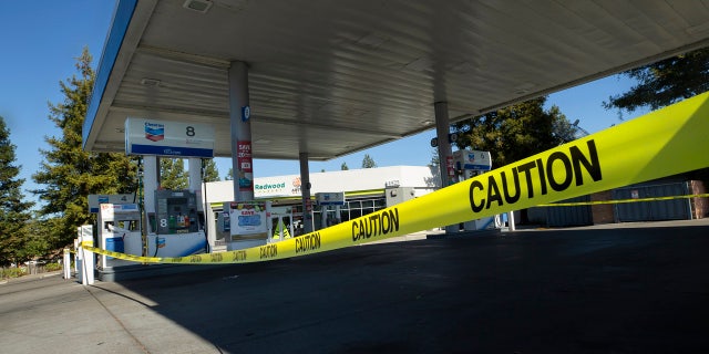 Caution tape is shown around a Chevron gas stations without power in Santa Rosa, Calif., Wednesday, Oct. 9, 2019.