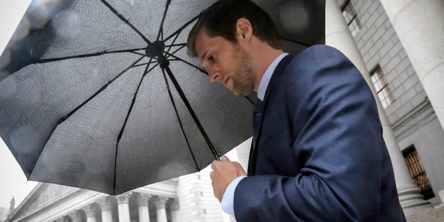 Cameron Collins, son of former U.S. Rep. Chris Collins, leaves court after pleading guilty in an insider trading case in October 2019. (AP Photo/Bebeto Matthews)