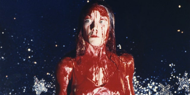 In the musical, Wolfe plays the titular role of Carrie White, made famous by Sissy Spacek in the 1976 film (pictured above), and was dressed as Carrie during the climactic scene – prom dress, tiara and tons of fake blood.