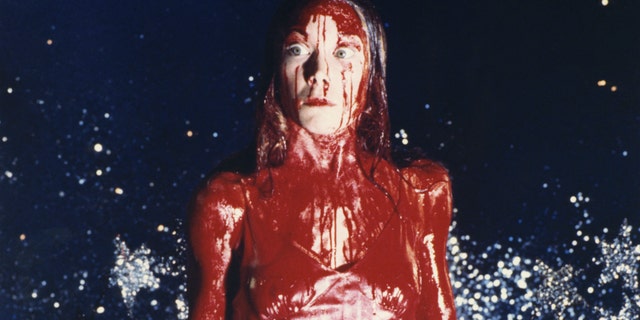 In the musical, Wolfe plays the titular role of Carrie White, made famous by Sissy Spacek in the 1976 film (pictured above), and was dressed as Carrie during the climactic scene – prom dress, tiara and tons of fake blood.