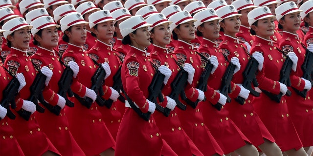 Members of a Chinese military honor guard march during the celebration to commemorate the 70th anniversary of the founding of Communist China in Beijing, Tuesday, Oct. 1, 2019. (AP Photo/Ng Han Guan)