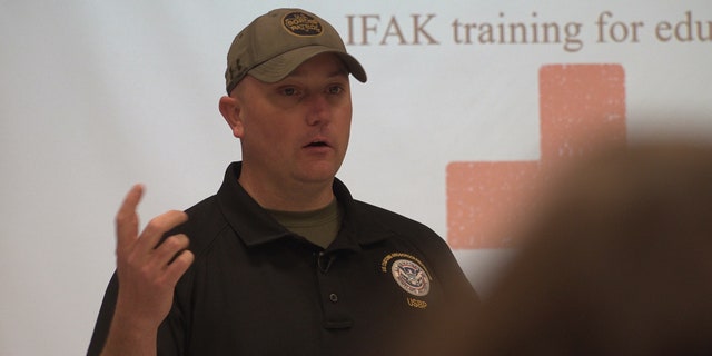 Supervisory U.S. Border Patrol agent trains educators on IFAK, or individualized first aid kits, commonly used in active combat zones.
