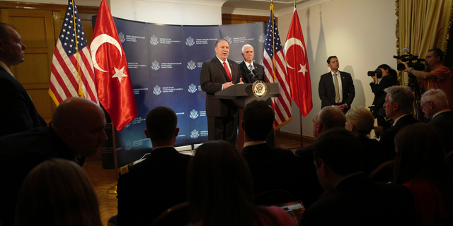 U.S. Secretary of State Mike Pompeo speaks as Vice President Mike Pence listens during a news conference at the U.S. ambassador's residence in Ankara, Turkey, Thursday, Oct. 17, 2019. The U.S. and Turkey agreed to a five-day cease-fire in the Turks' attacks on Kurdish fighters in northern Syria to allow the Kurds to withdraw to roughly 20 miles away from the Turkish border. The arrangement appeared to be a significant embrace of Turkey's position in the weeklong conflict. (AP Photo/Burhan Ozbilici) (AP Photo/Burhan Ozbilici)