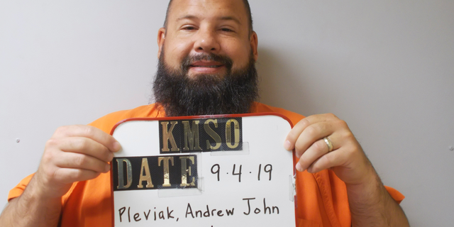FILE -This Sept. 4, 2019 booking photo provided by the Kingman County Sheriff's Office shows Andrew John Pleviak. The former agent with U.S. Immigration and Customs Enforcement has pleaded guilty to helping an inmate try to escape from a Kansas jail by impersonating an immigration officer. Pleviak pleaded guilty Wednesday, Oct. 16, in Kingman County District Court to making false information and attempted aiding of escape. He's also charged in federal court with false impersonation of a federal officer. (Kingman County Sheriff's Office via AP)