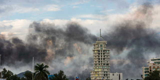 Smoke from burning cars rises due in Culiacan, Mexico, Thursday, Oct. 17, 2019. An intense gunfight with heavy weapons and burning vehicles blocking roads raged in the capital of Mexico’s Sinaloa state Thursday after security forces located one of Joaquín “El Chapo” Guzmán’s sons who is wanted in the U.S. on drug trafficking charges. (AP Photo/Hector Parra)