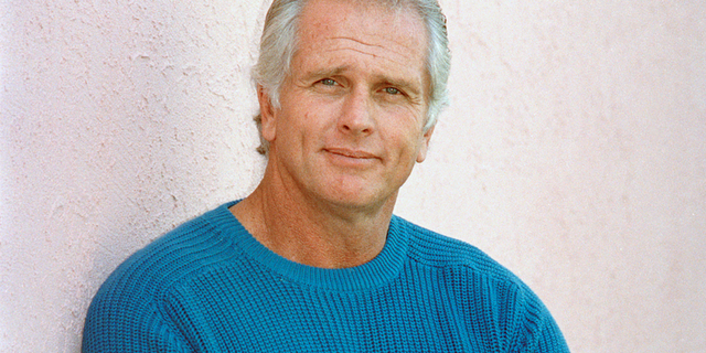 FILE - This Dec. 28, 1987 file photo shows former “Tarzan” actor Ron Ely during an interview in Los Angeles. (AP Photo/Reed Saxon, File)