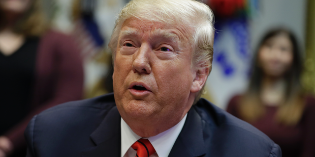 President Donald Trump speaks to NASA astronauts carrying out the first ever all-female spacewalk, during a call from the Roosevelt Room of the White House, Friday, Oct. 18, 2019, in Washington. (AP Photo/Evan Vucci)